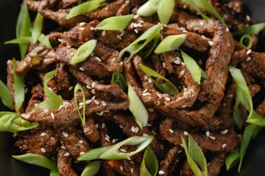 Korean beef Bulgogi BBQ with sesame seeds and spring onion