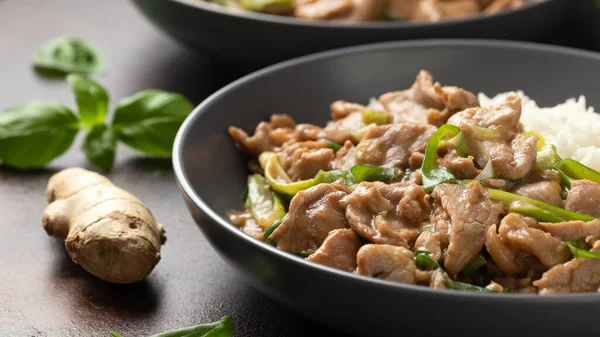 Chinese stir fry pork with ginger sauce, garlic and spring onion. Asian food.