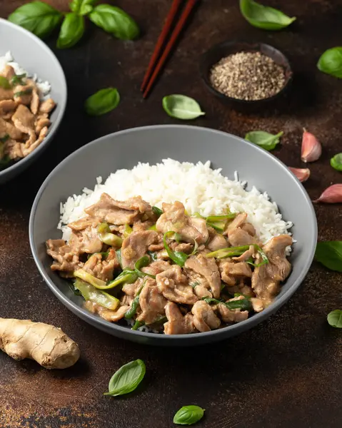 Chinese stir fry pork with ginger sauce, garlic and spring onion. Asian food.