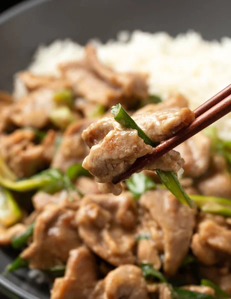 Chinese stir fry pork with ginger sauce, garlic and spring onion. Asian food.