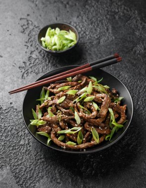Korean beef Bulgogi BBQ with sesame seeds and spring onion