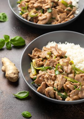 Chinese stir fry pork with ginger sauce, garlic and spring onion. Asian food.