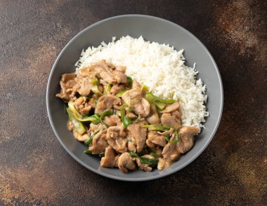 Chinese stir fry pork with ginger sauce, garlic and spring onion. Asian food.