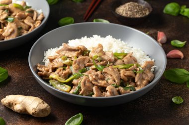 Chinese stir fry pork with ginger sauce, garlic and spring onion. Asian food.
