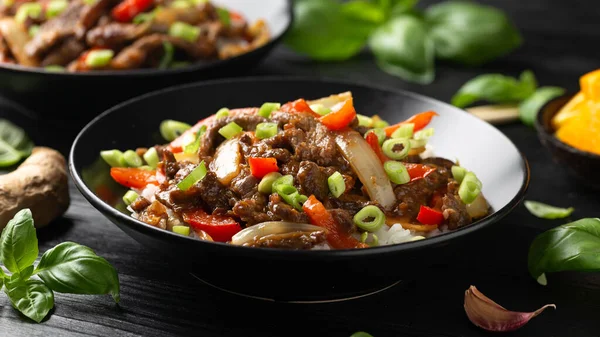 stock image Stir fry Crispy Orange Beef with sweet peppers, onion and rice. Asian food.