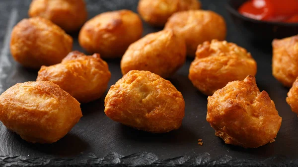 Stock image Battered chicken balls with tomato ketchup, party finger food concept.