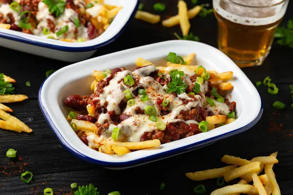 Chili Cheese Potato Fries topped with hot minced beef and cheese sauce.