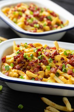 Crispy French fries loaded with bacon, cheese sauce and spring onion.