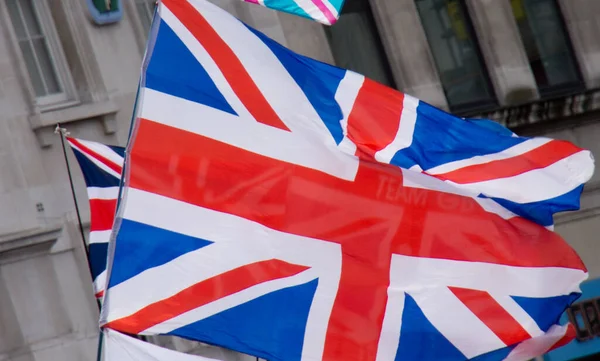 Close-up of a union flight for Union Jack fluttering in the breeze, the national flag of the United Kingdom