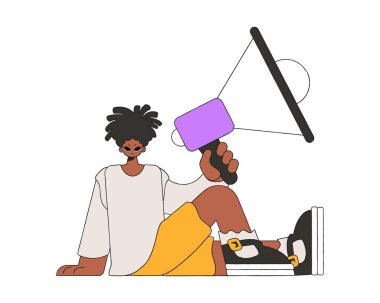 A young guy sits on the floor and holds a megaphone in his hand.