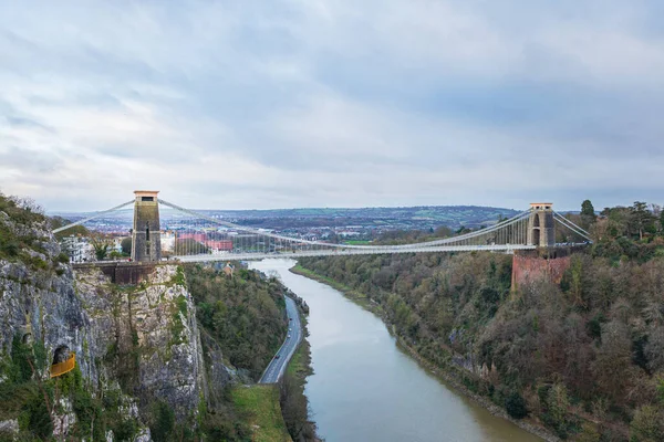 stock image wide angle view of the landmark of Bristol, Clifton Suspension Bridge and Clifton Observatory, in a overcast day, winter.