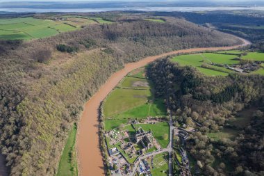 Amazing aerial panorama of Tintern Abbey, River Wye, and the nearby landscape, UK clipart