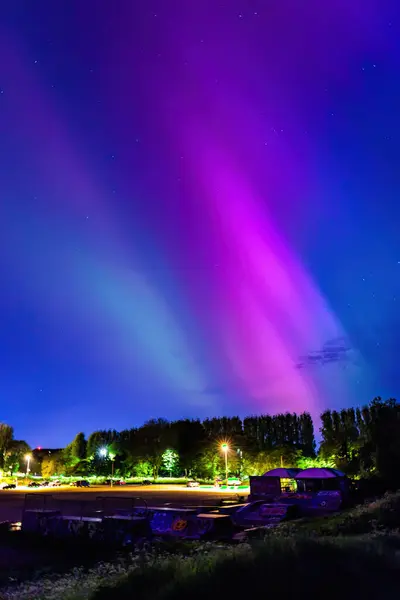 stock image the unusual astronomy event, Aurora Northern Light in Downtown center of Caversham, Reading, Berkshire, England, summer 2024