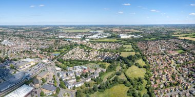 Bicester Village and Bicester town center, amazing aerial view in summer daytime, uk clipart