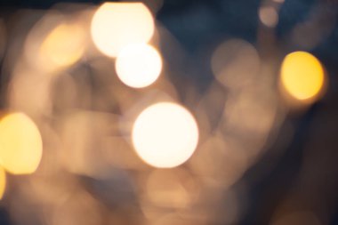 Abstract background with bokeh defocused lights , vintage or retro color tone. Copy space. Festive card . Defocused photo. 