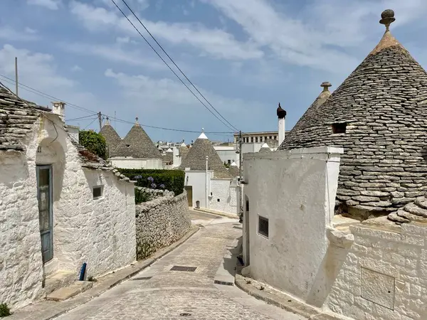 stock image Alberobello, Italy - July 2024. Trulli or Trullo house, an UNESCO World Heritage, in the City of Alberobello, Puglia Region, a famous touristic destination in south Italy.