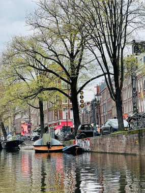 Traditional boats and canals in Amsterdam, Netherlands, Europe, 22 April 2022 . clipart