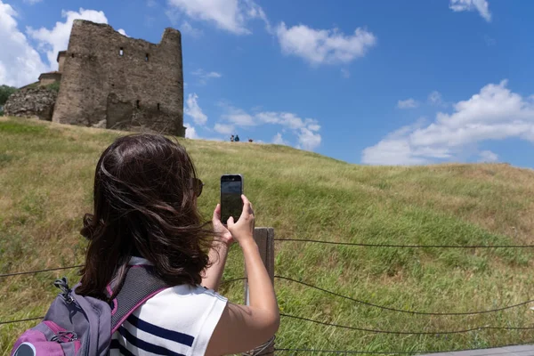 Woman Using Smartphone to Shoot Photo of Ancient Sightseeing During Vacation in Summer in Georgia