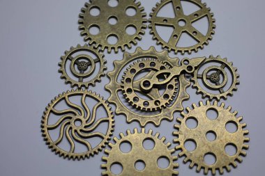 Brass gears are interlocked and form a gear or clockwork