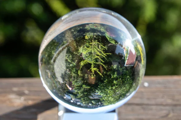 stock image The landscape is turned upside down in the glass ball