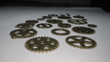 Brass gears are interlocked and form a gear or clockwork
