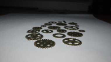 Brass gears are interlocked and form a gear or clockwork