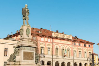 Biella, Piedmont, Italy - January 30, 2023: Monument to Quintino Sella, in front of the social theater Villani, in center of Biella.