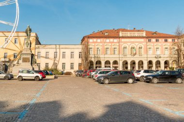 Biella, Piedmont, Italy - January 30, 2023: The Social theater Villani, with parking area in front in the center of Biella.