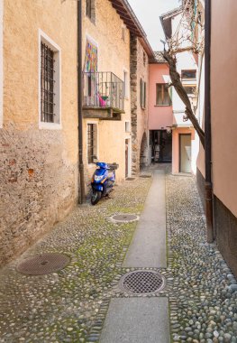 Narrow street in the historic center of Vira Gambarogno, the town overlooks Lake Maggiore, district of Locarno, Ticino, Switzerland clipart