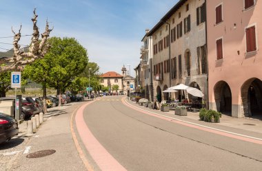 Bissone, Lugano, Switzerland - April 21, 2024: Main street of Bissone, is a Swiss municipality of Ticino, overlooks of Lake Lugano, in the district of Lugano clipart