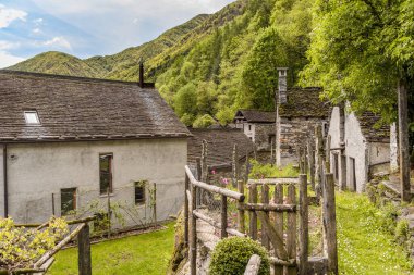 Ancient village Moghegno with rustic stone houses, hamlet of Maggia in the Canton of Ticino, Switzerland clipart