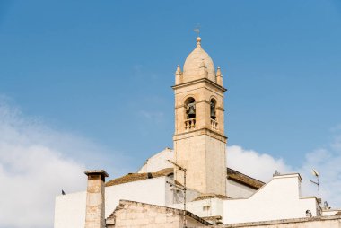 The bell tower of the Santa Lucia Church in the ancient village of Alberobello, Puglia, Italy clipart