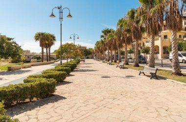 The promenade of Pozzallo on a sunny autumn day, located in the Free Municipal Consortium of Ragusa, is a popular seaside resort, Eastern Sicily, Italy clipart