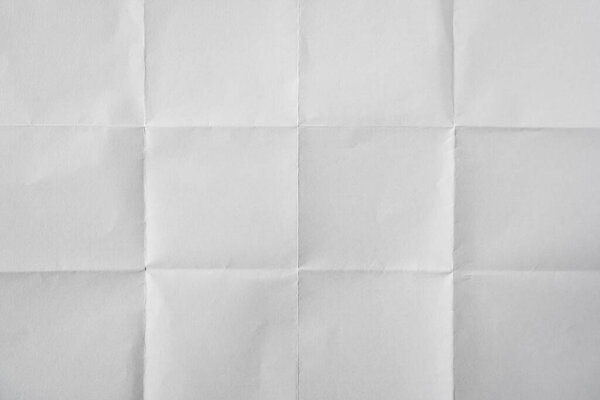 White paper folded four times background