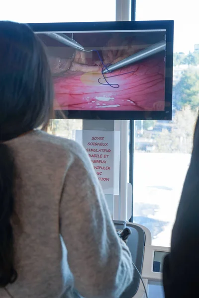 stock image Internal students in digestive surgery train on a Lap Sim simulation device for surgical procedures. Students should tie a knot using surgical instruments.