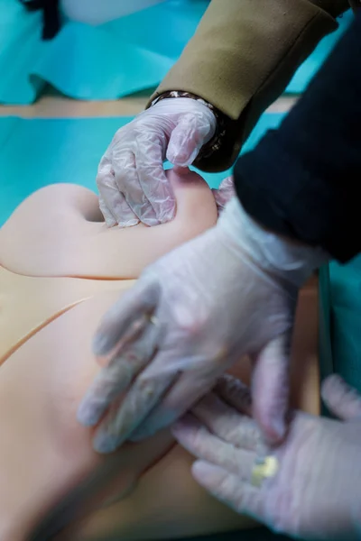 stock image 5th year student of medicine during a course in Gynecology at the medical university of Nimes. Breast palpation exercises on a prosthesis.