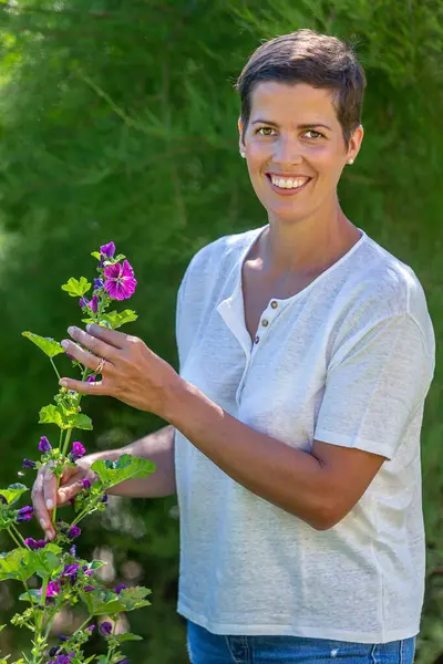 Young Woman Front Holding Stem Hollyhocks — Stock Photo, Image