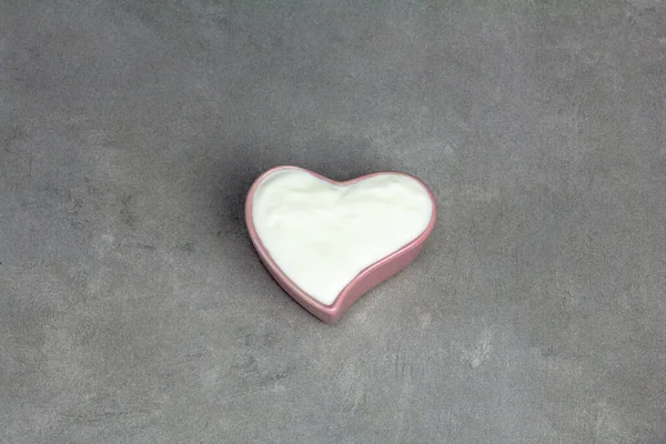 Yogurt Heart Shaped Bowl Top View Gray Concrete Background — Φωτογραφία Αρχείου