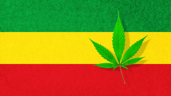Cannabis hemp leaf on rasta flag colors background. Striped vintage texture in rasta reggae colors with marijuana leaf.