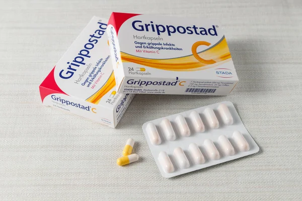  Grippostad packaging, blister pack sample and capsules for symptomatic treatment of flu or cold infections
