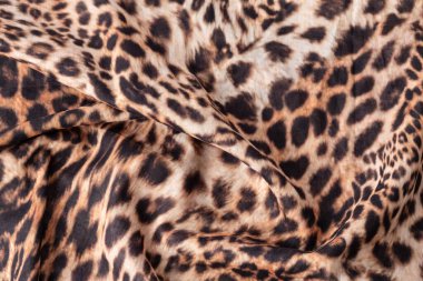 Soyut leopar dokusu arkaplanı. Moda desenli pamuk kumaş. Vahşi hayvan baskısı pamuk örneği.