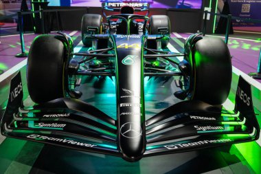 Kuala Lumpur, Malaysia - May 24,2024 : Petronas's F1 displayed at The Malaysia Autoshow 2024 was held at the Malaysia Agro Exposition Park Serdang (MAEPS), visitors can seen exploring around it. clipart