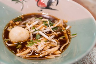 Close-up view of the delicious Pathumthani boat noodle. clipart