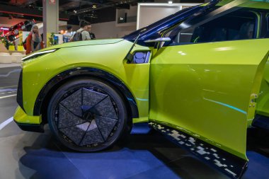 Kuala Lumpur, Malaysia - Dec 8,2024 : Perodua eMO-II EV Concept revealed in Kuala Lumpur International Mobility Show, people can seen exploring around it. clipart