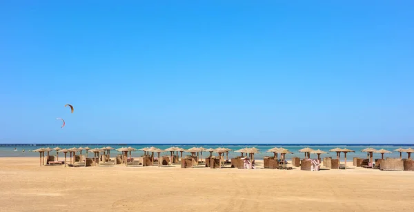 stock image An empty beach with sun umbrellas in distance, Marsa Alam, Egypt.