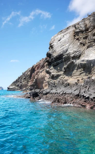 stock image Rocky cliff seen from the water, Galapagos Islands, Ecuador.