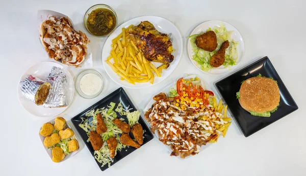 Chef of the kebab restaurant, traditional Turkish and Arabic food, overhead shot of the multiple dishes