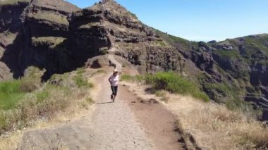 Trekking path next to the waterfall in the Levada do Caldeirao Verde, Queimadas, Madeira