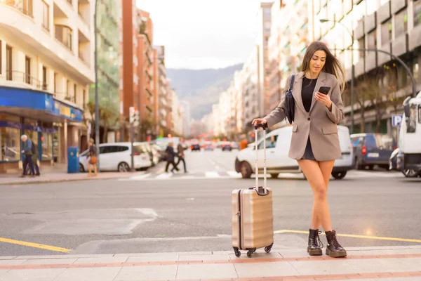 Tourist woman with suitcase in the city, vacation concept, lifestyle