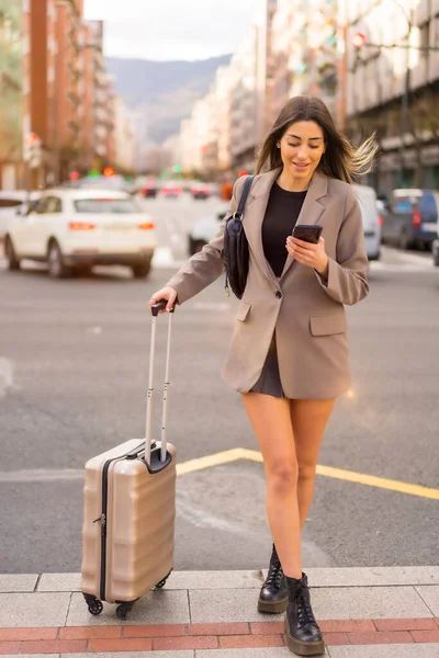 Tourist woman with suitcase in the city, vacation concept, lifestyle